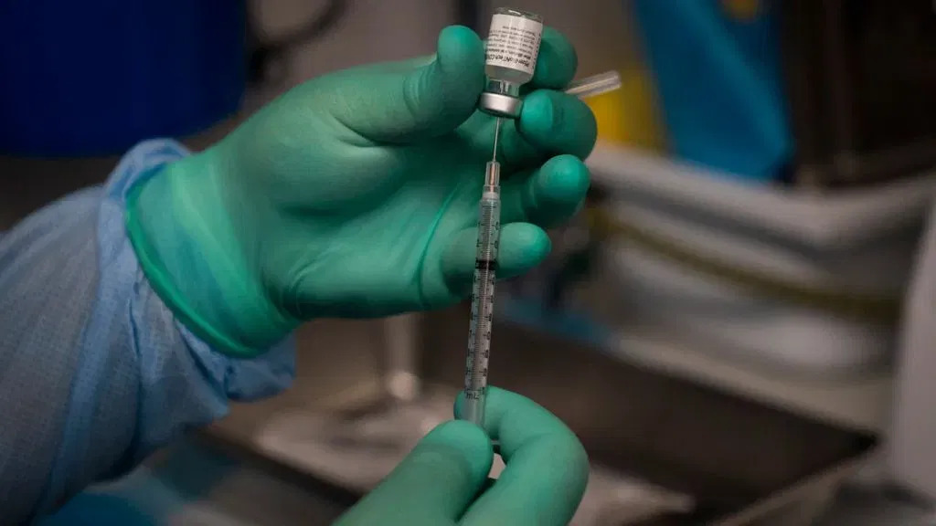 Vaccine Development Targets Future COVID Strains. Credit | AP